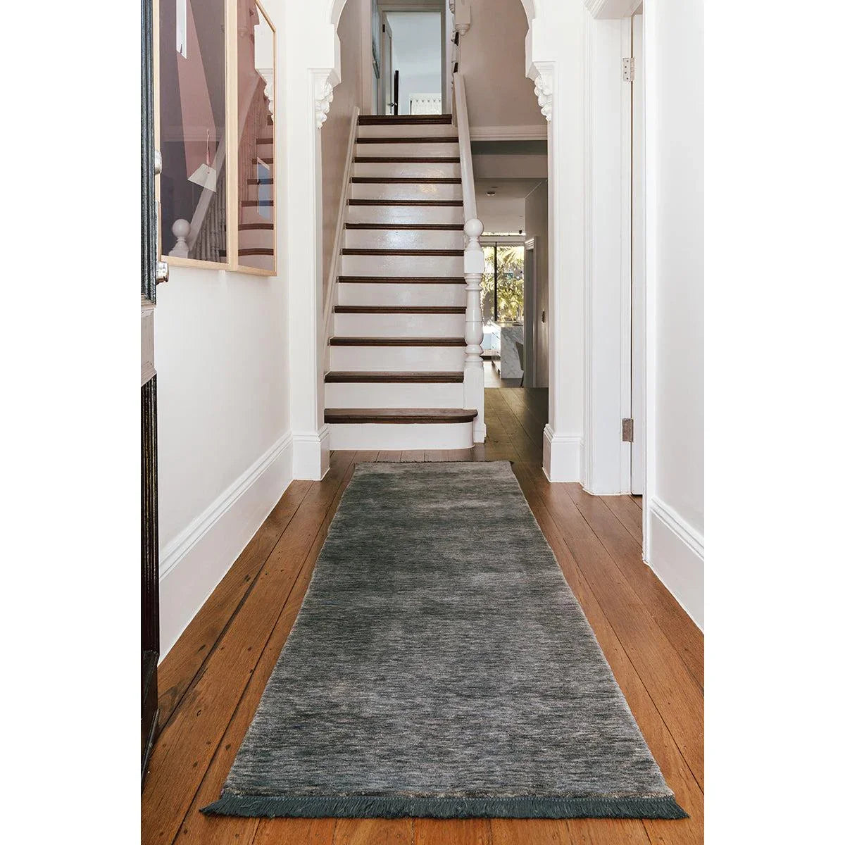Conscious Loom Kinship Seal Grey Runner Rug featuring textured seal grey with charcoal and light grey on brown floor, hand-woven wool