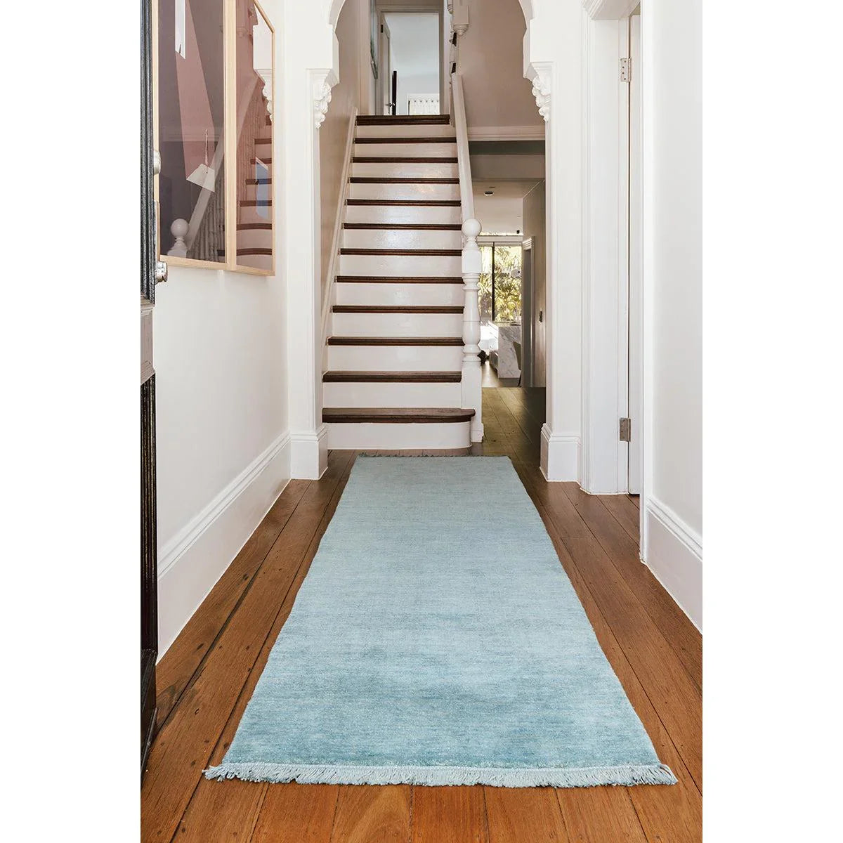 Conscious Loom Kinship Sky Blue Runner Rug featuring solid sky blue on brown floor with white walls, hand-tufted wool