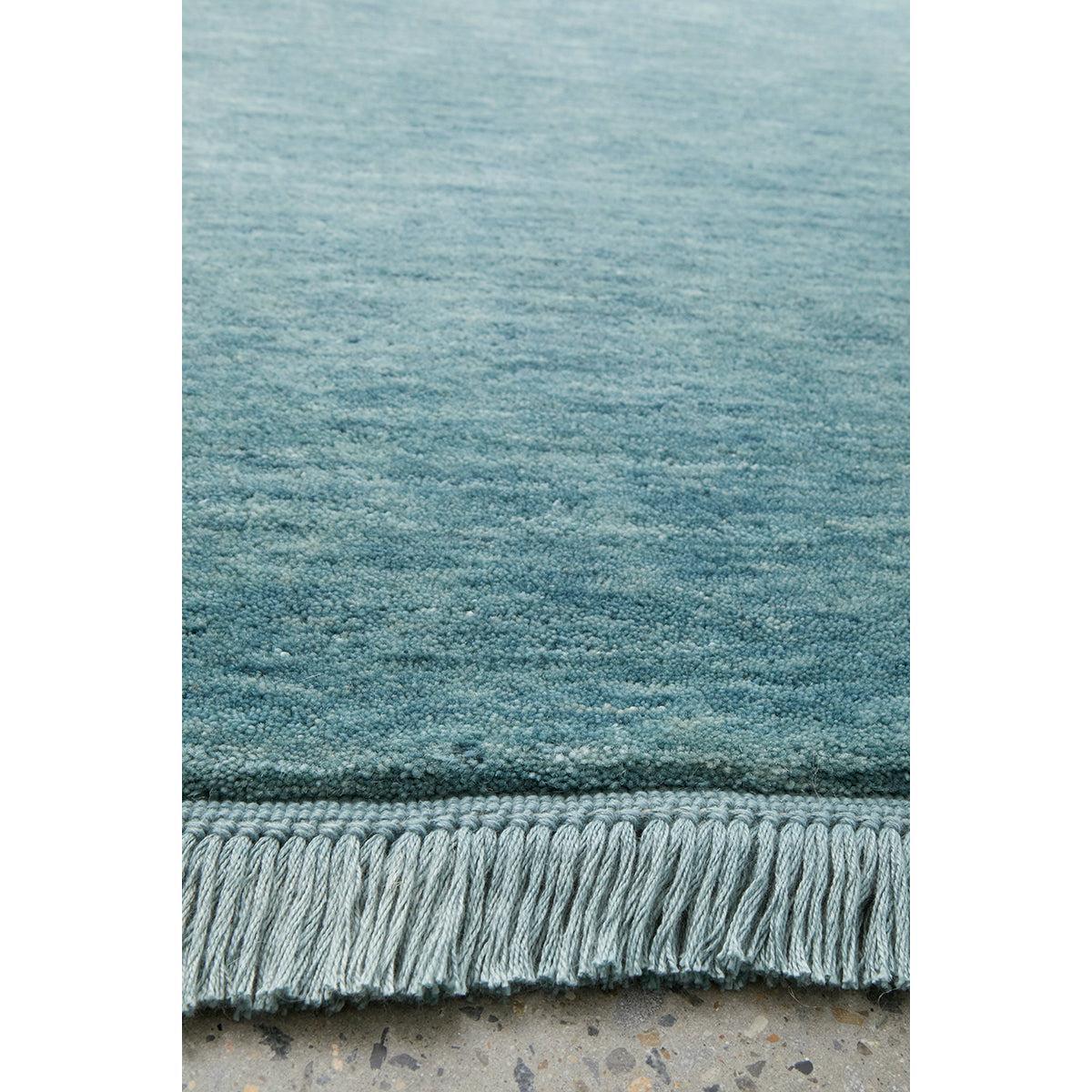 Conscious Loom Kinship Sky Blue Runner Rug featuring solid gradient teal to sky blue on concrete grey, handwoven wool
