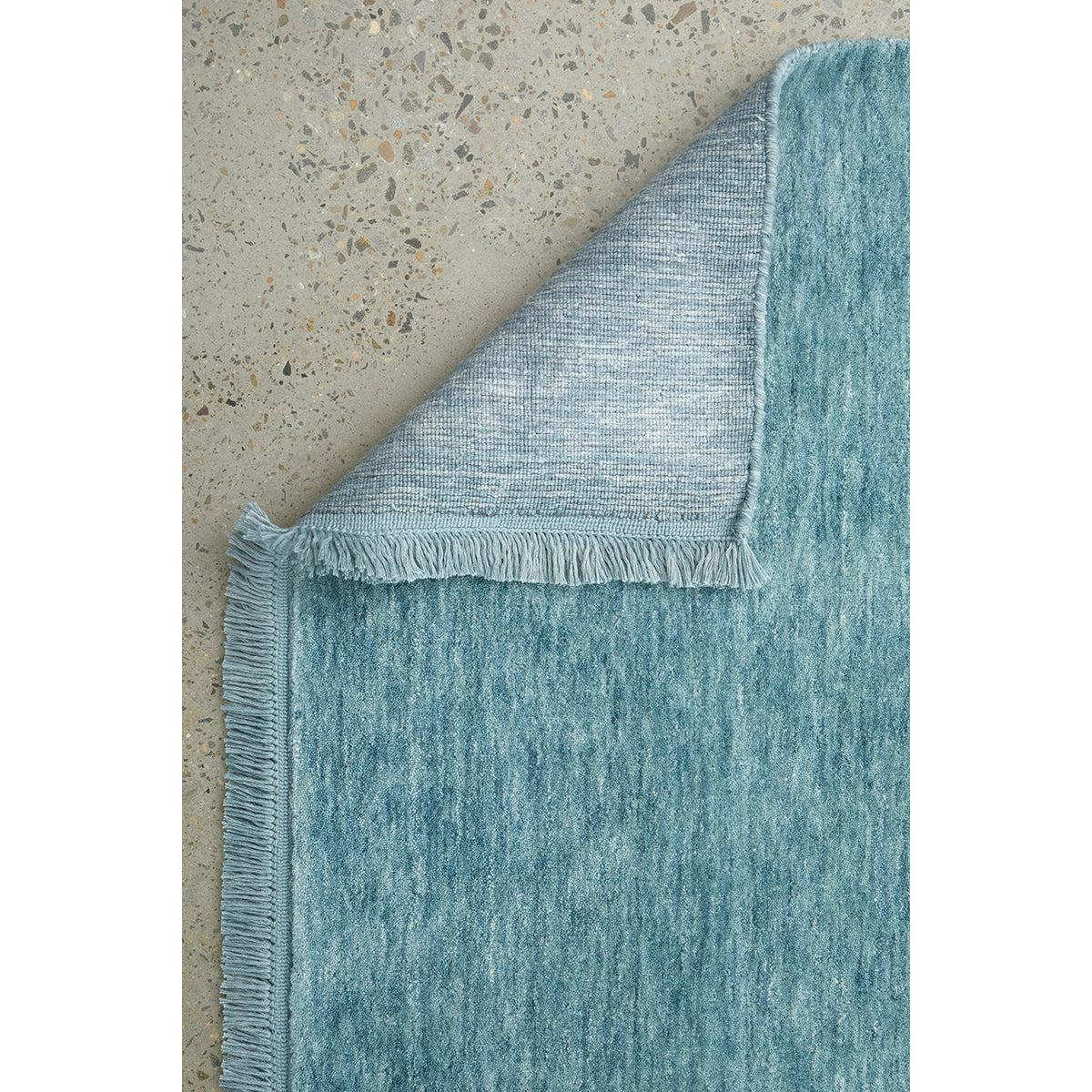 Conscious Loom Kinship Sky Blue Runner Rug featuring distressed gradient in sky blue, powder blue, teal on beige background, hand-woven wool