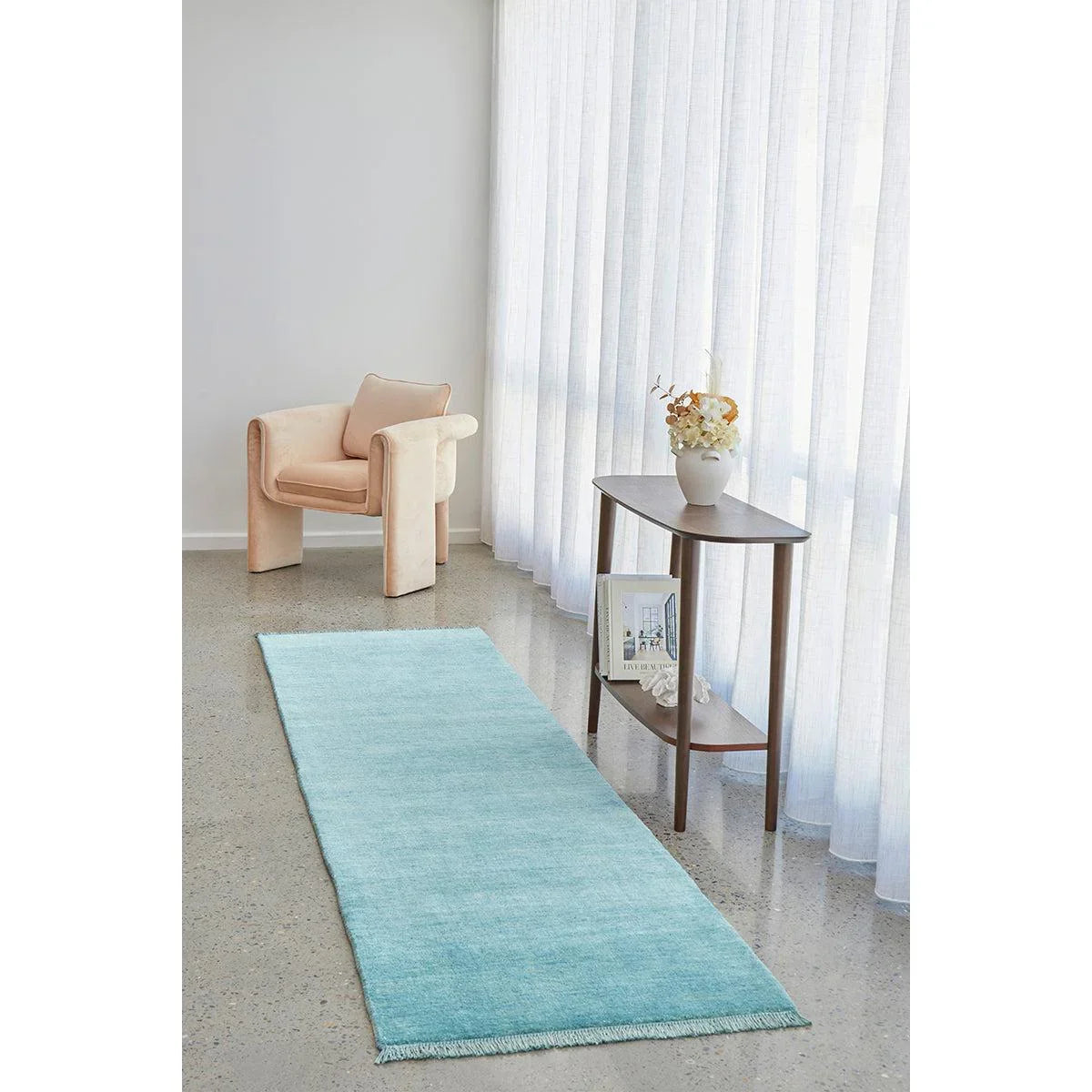 Conscious Loom Kinship Sky Blue Runner Rug featuring solid sky blue and aqua on light grey floor, hand-loomed wool