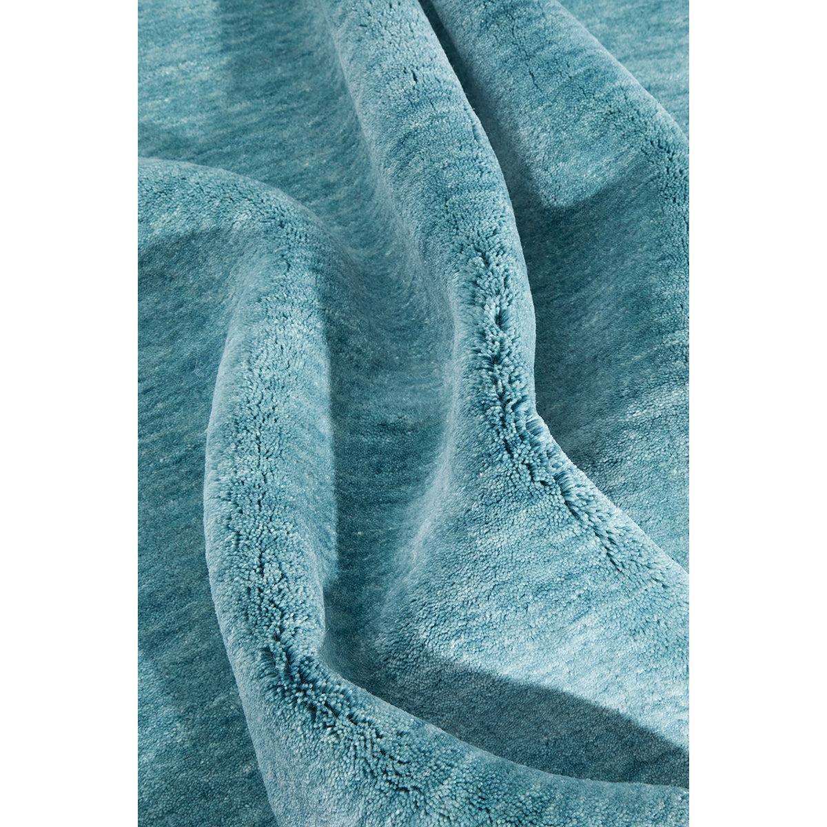 Conscious Loom Kinship Sky Blue Rug featuring plush textured pile in sky blue, teal on white, loom-woven polyester