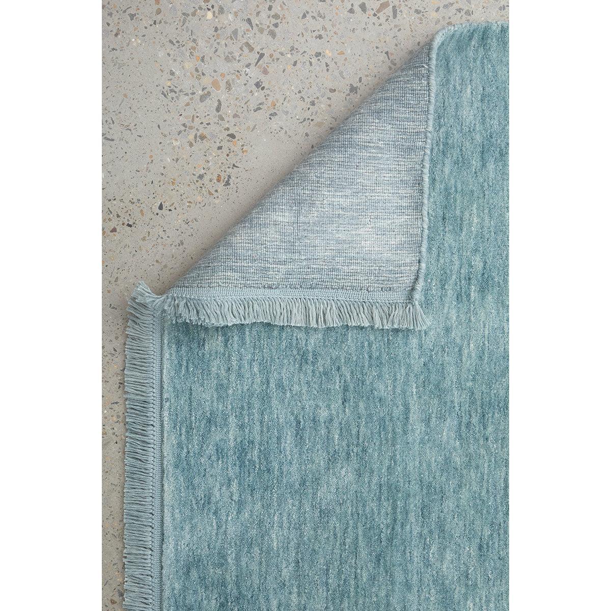 Conscious Loom Kinship Sky Blue Rug featuring abstract gradient in sky blue, teal, aqua and grey on concrete grey, hand-tufted wool
