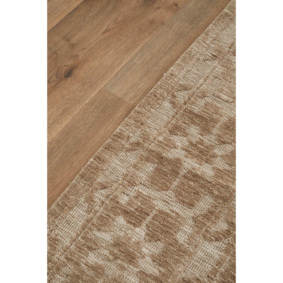 Darren Palmer Ceylon Almond Rug with abstract geometric pattern in almond, beige and ivory on brown wood, tufted wool