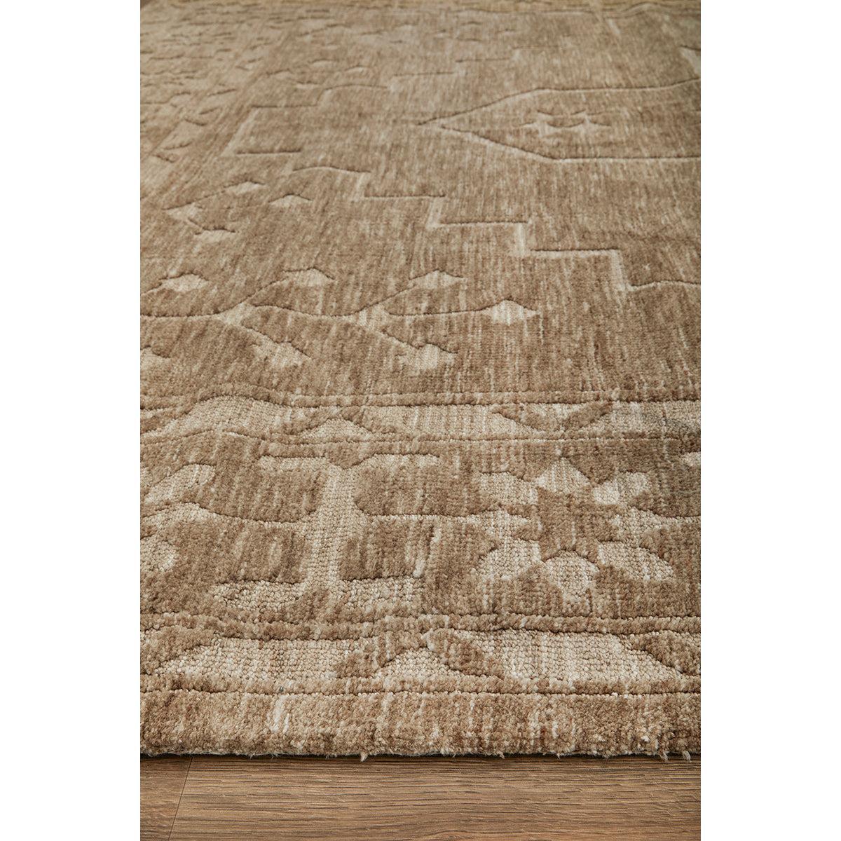 Darren Palmer Ceylon Almond Rug featuring abstract pattern in almond, beige and taupe on warm brown floor; unknown