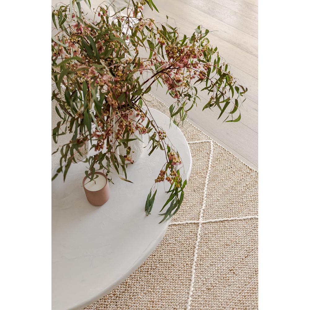 Darren Palmer Earth Natural Rug featuring grid in natural beige, ivory and cream on pale beige floor, hand-woven jute