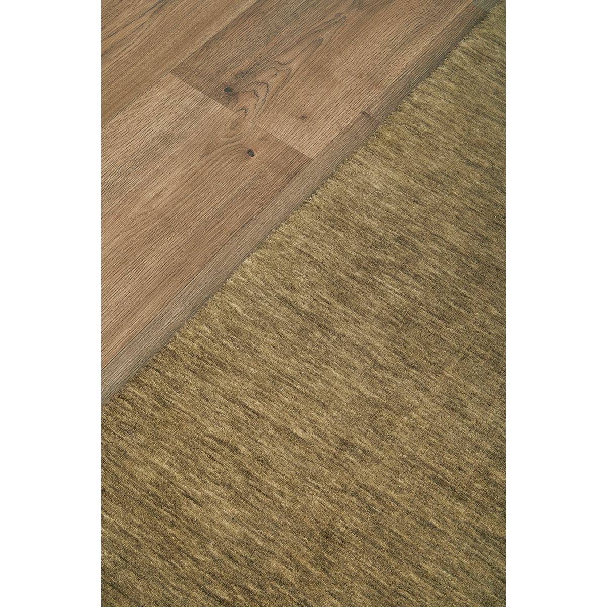 Darren Palmer Legacy Olive Runner Rug featuring textured weave in olive and khaki on warm brown wood floor, machine-woven wool