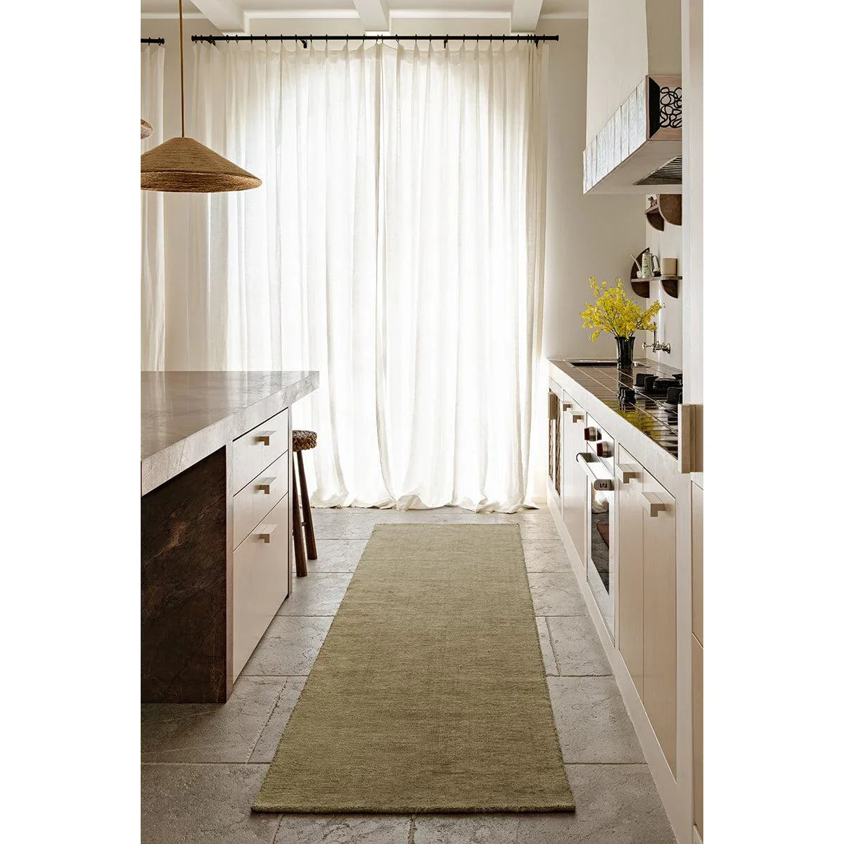 Darren Palmer Legacy Olive Rug featuring solid olive-green runner on cream kitchen background, machine-made wool