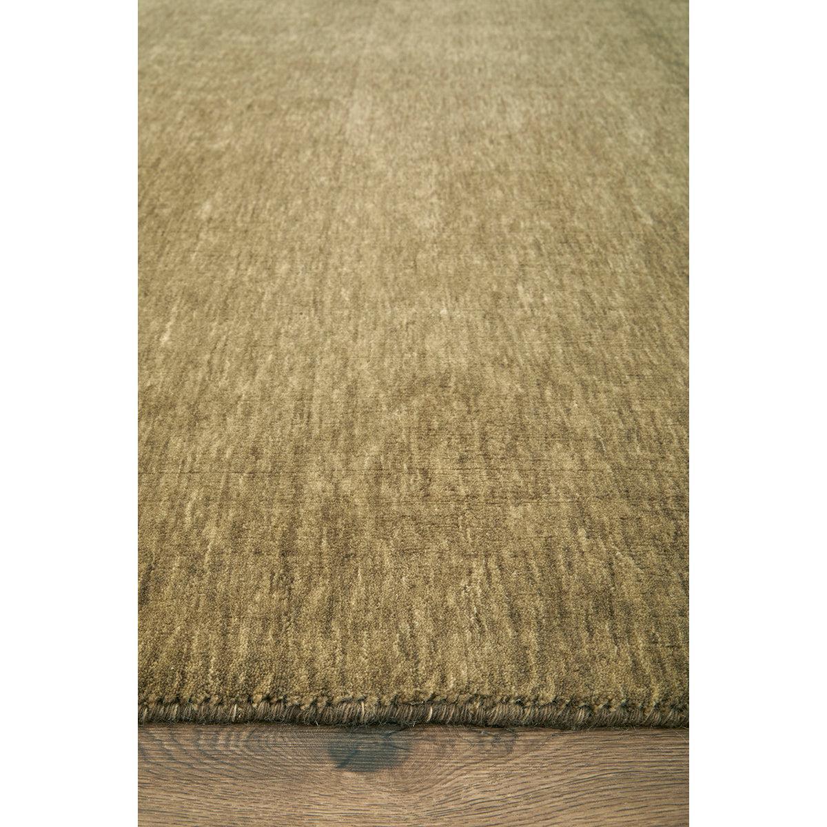 Darren Palmer Legacy Olive Rug featuring solid textured pattern in olive, sage, khaki on warm brown wood floor, hand-tufted wool