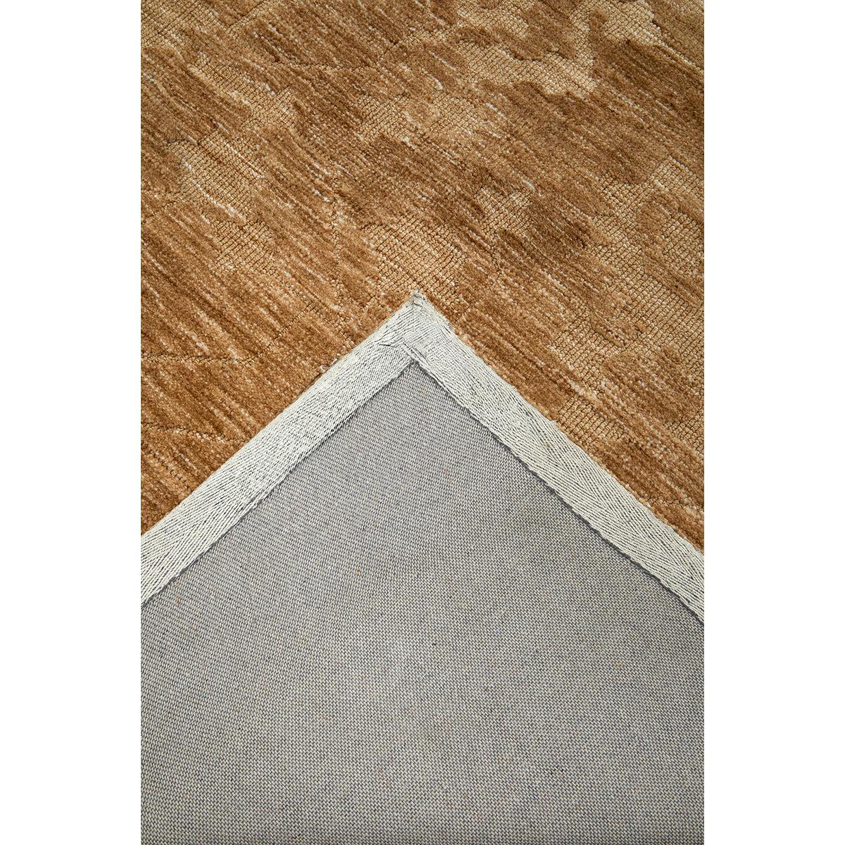 Darren Palmer Malabar Ginger Rug with textured pattern in ginger, copper and tan on grey backing, tufted wool