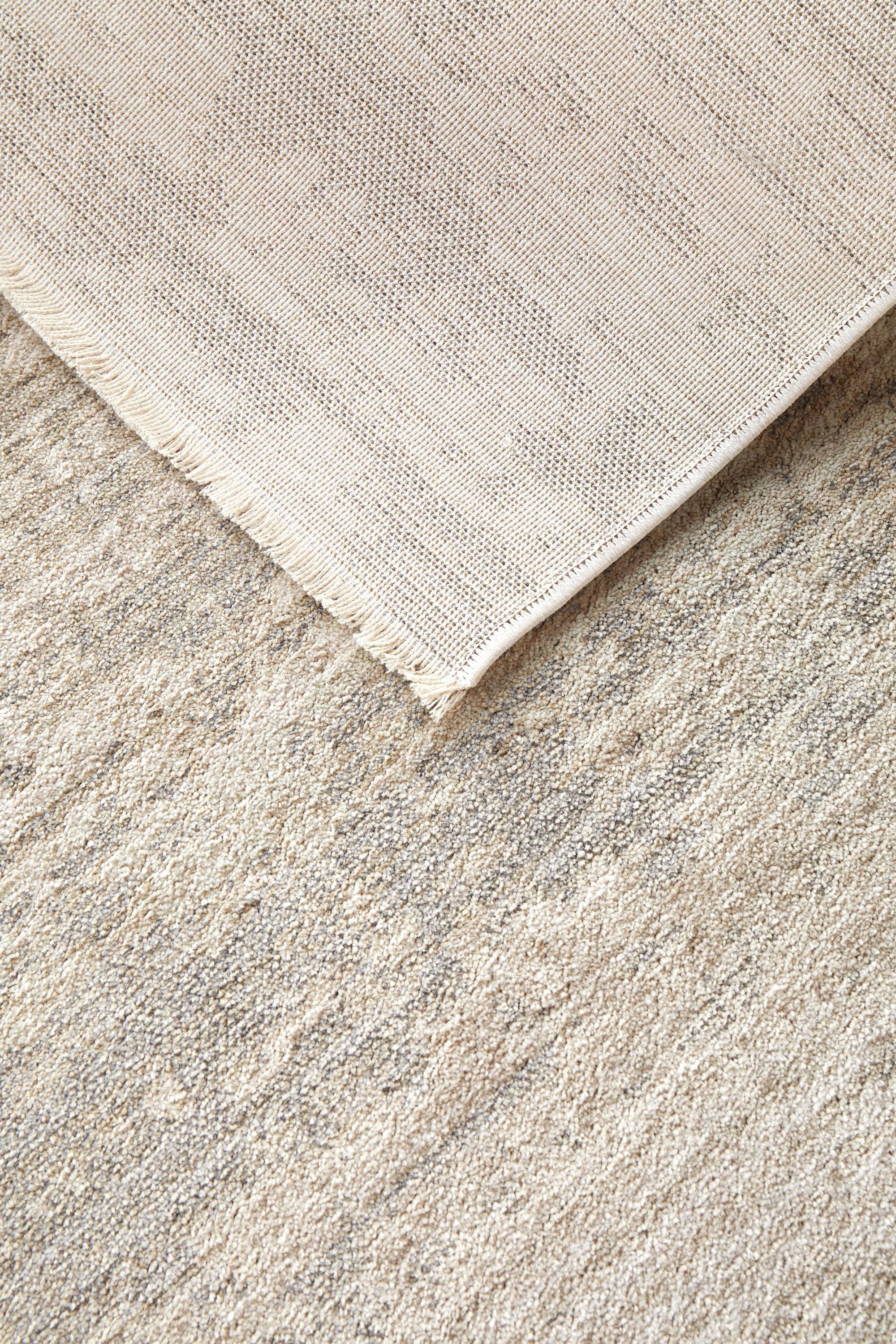 Darren Palmer Morgana Stone Rug featuring abstract textured pattern in beige, cream, taupe on beige background, machine-woven wool