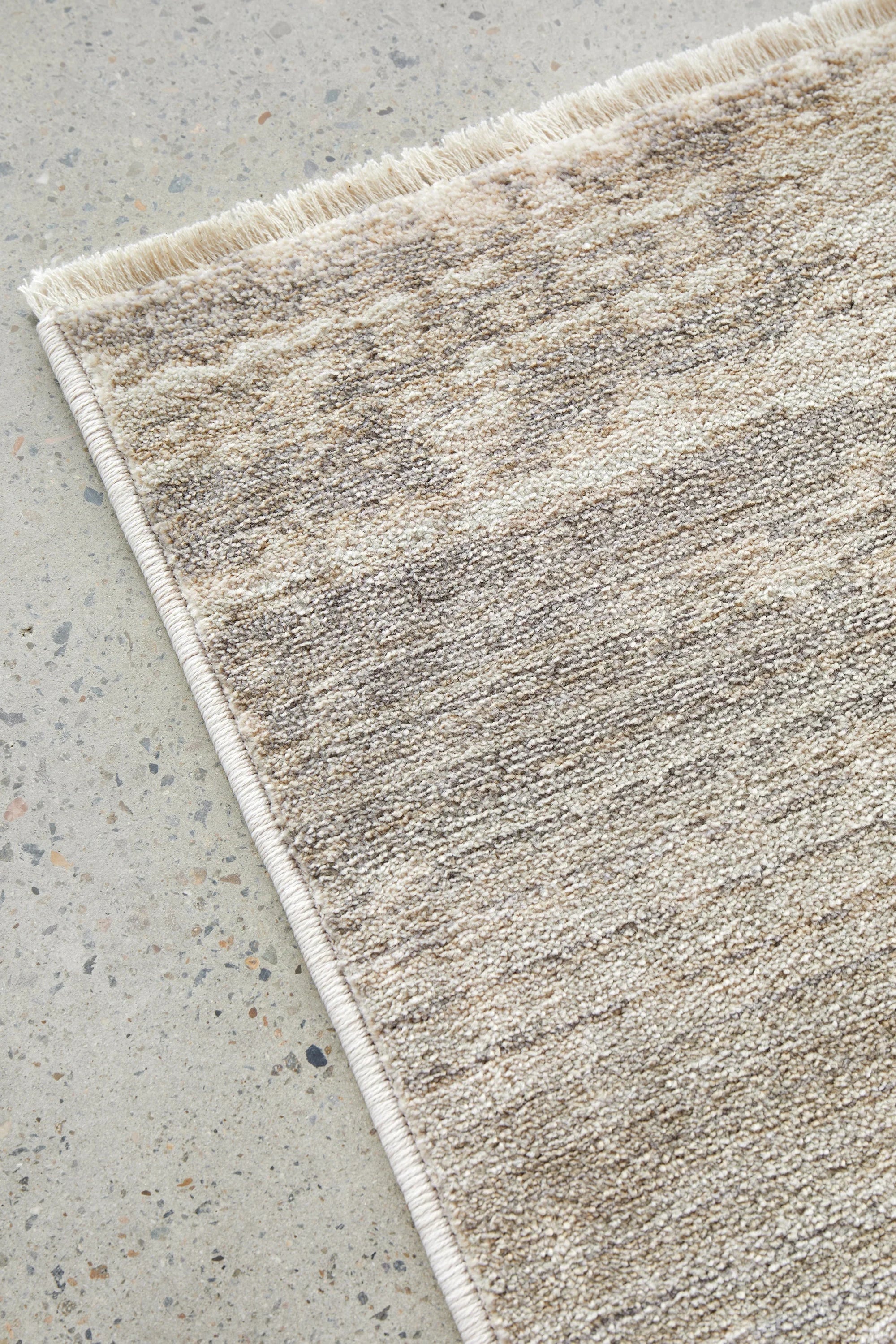 Darren Palmer Morgana Stone Rug featuring pattern in taupe, beige and cream on ivory background, hand-tufted wool