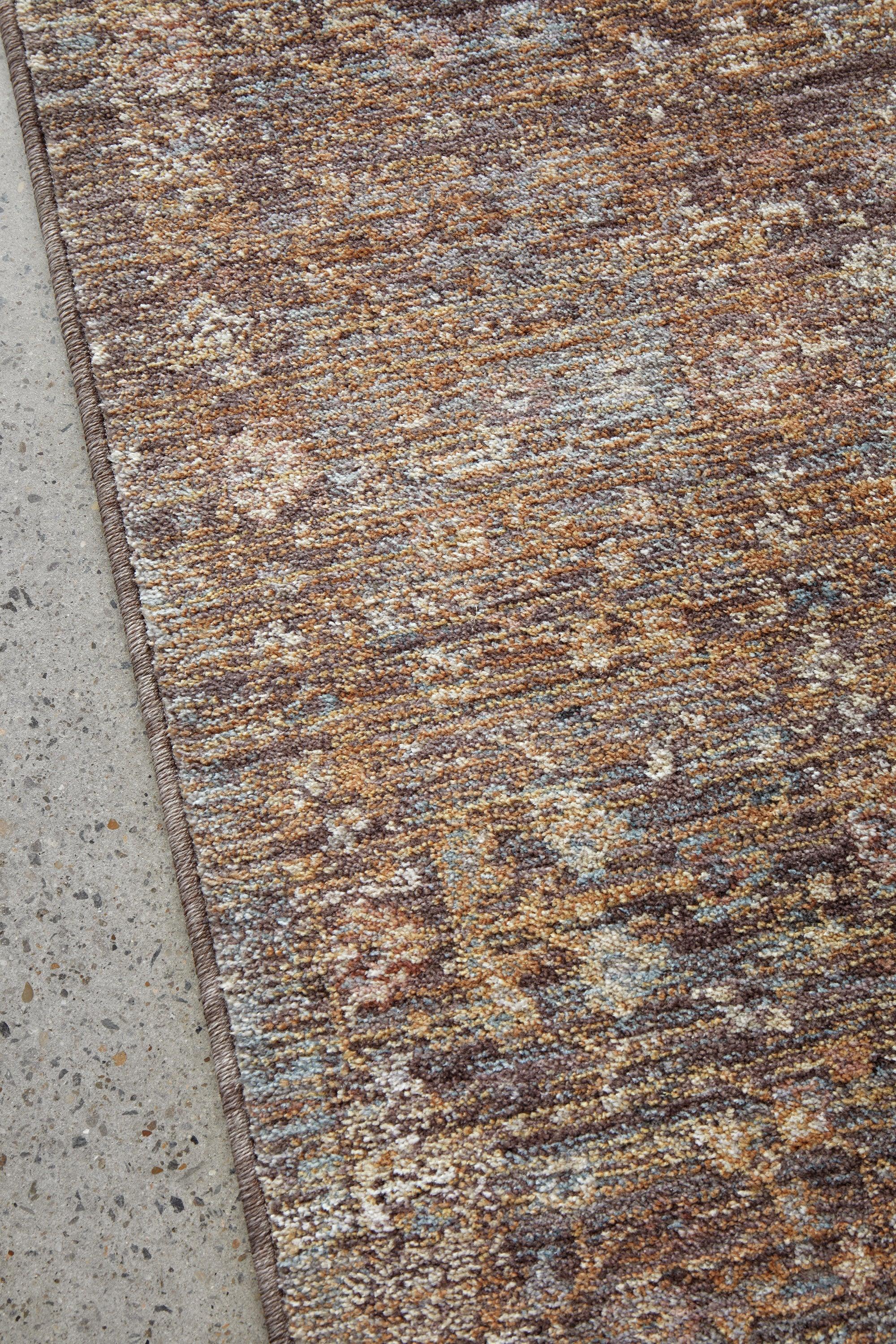 Darren Palmer Moorland Fig Rug featuring mottled pattern in brown, taupe, ivory and dusty blue on grey; handmade wool