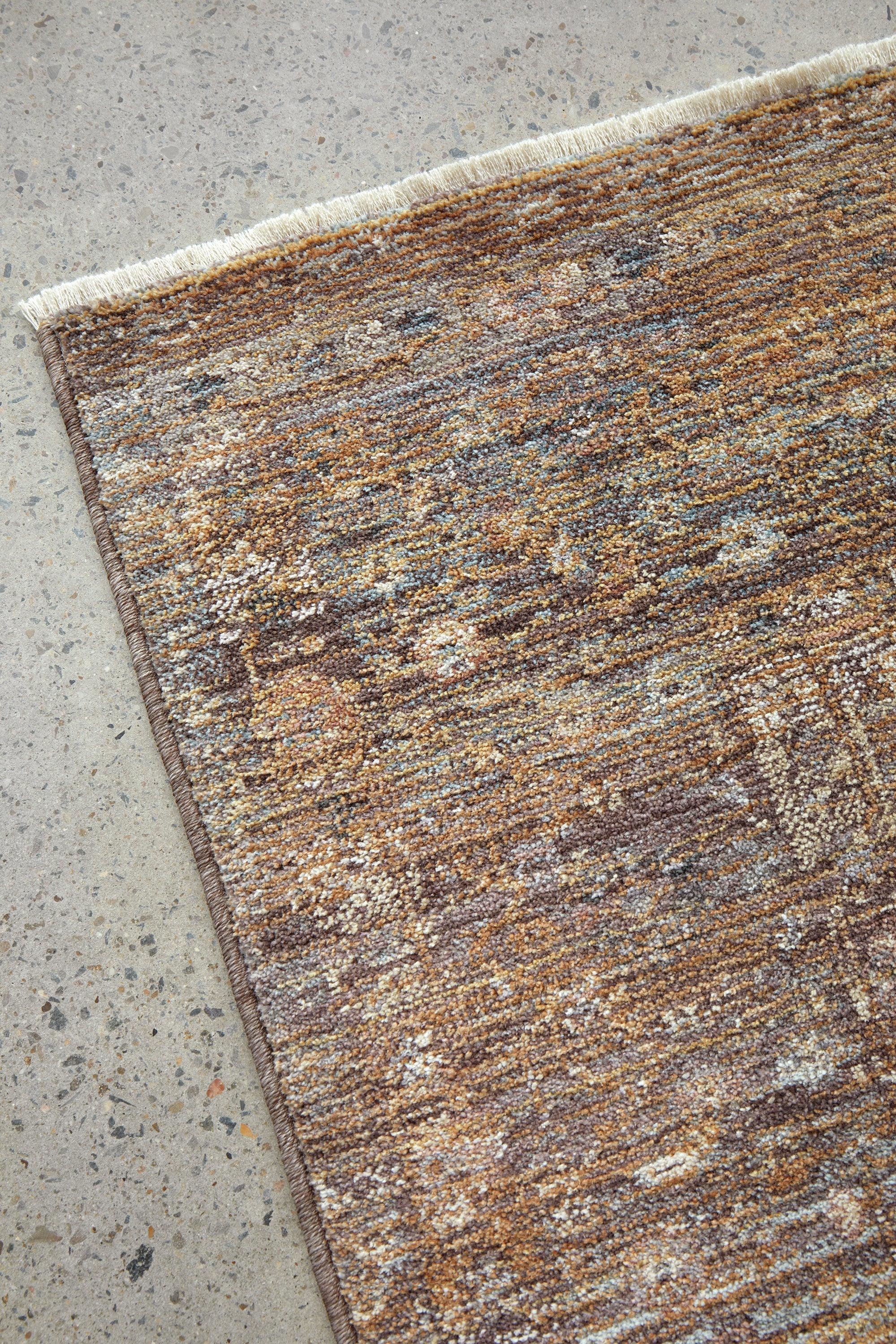 Darren Palmer Moorland Fig Rug with distressed abstract pattern in brown, beige and amber on beige, hand-tufted wool