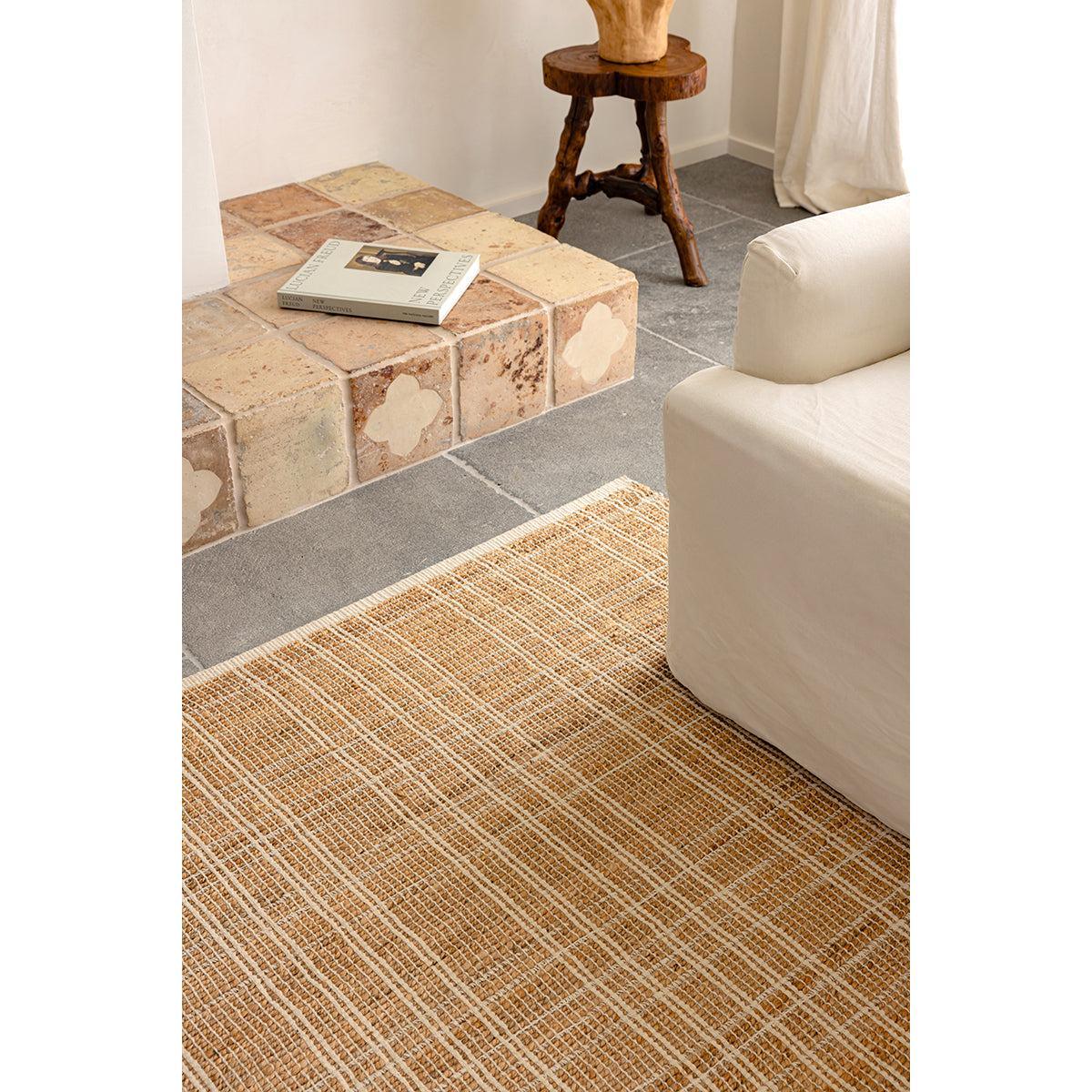 Darren Palmer Plaid Sandstone Rug featuring plaid in sandstone, cream and ivory on grey background, handwoven jute.