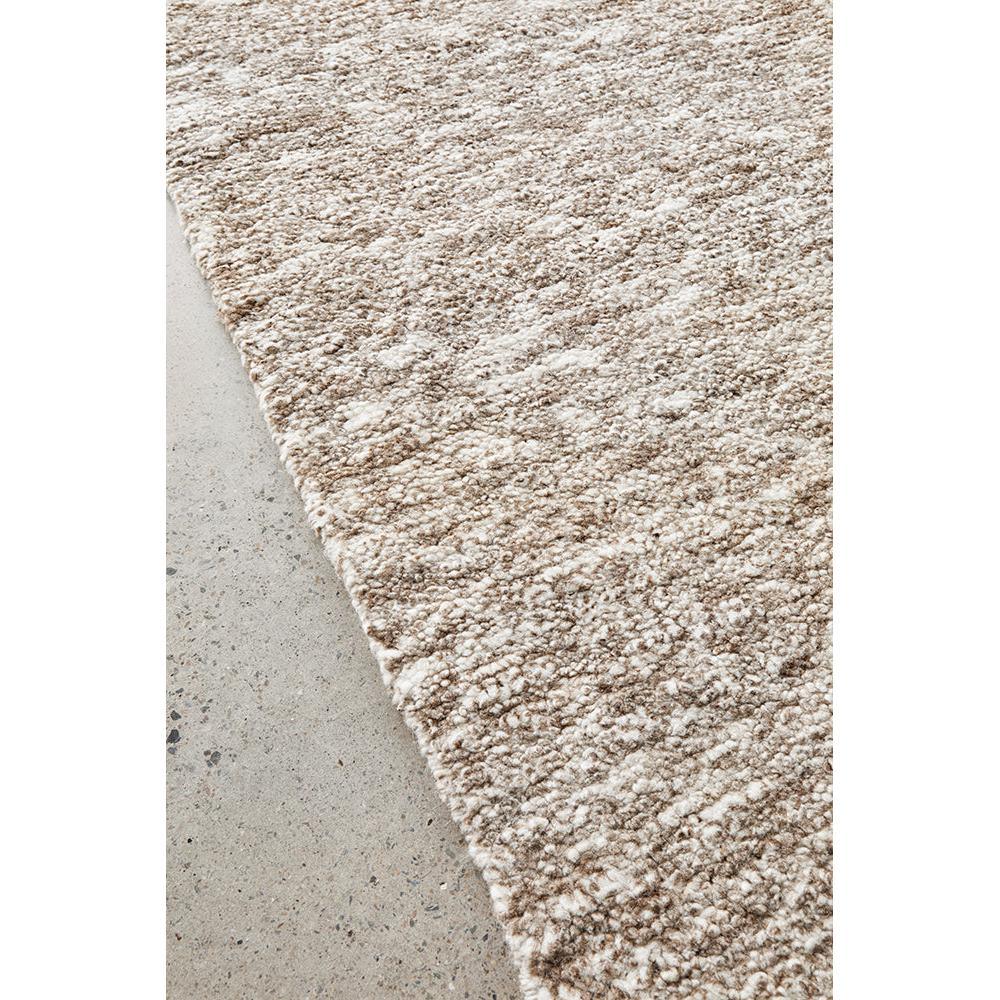 Darren Palmer Travertine Brown rug featuring shag pile in beige, taupe and cream on light grey concrete