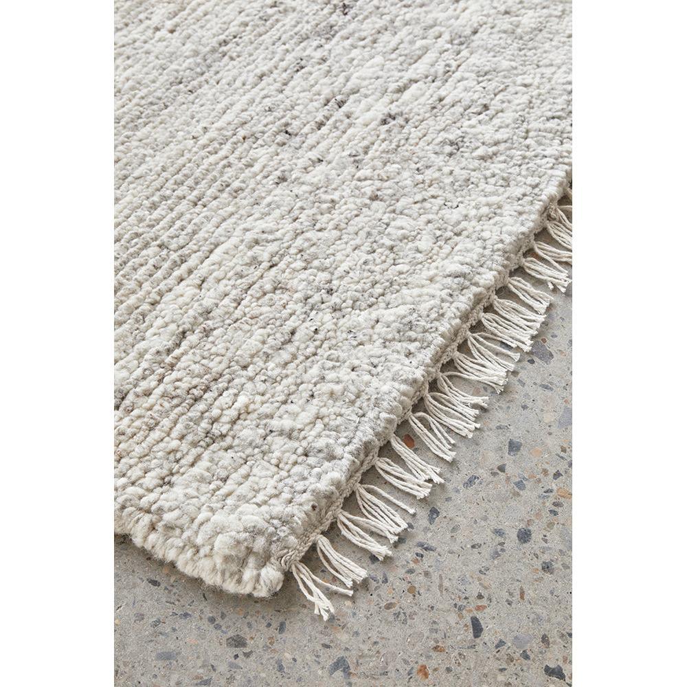 Darren Palmer Travertine Silver Rug with shaggy texture in ivory, cream and grey on light grey floor, hand-tufted wool