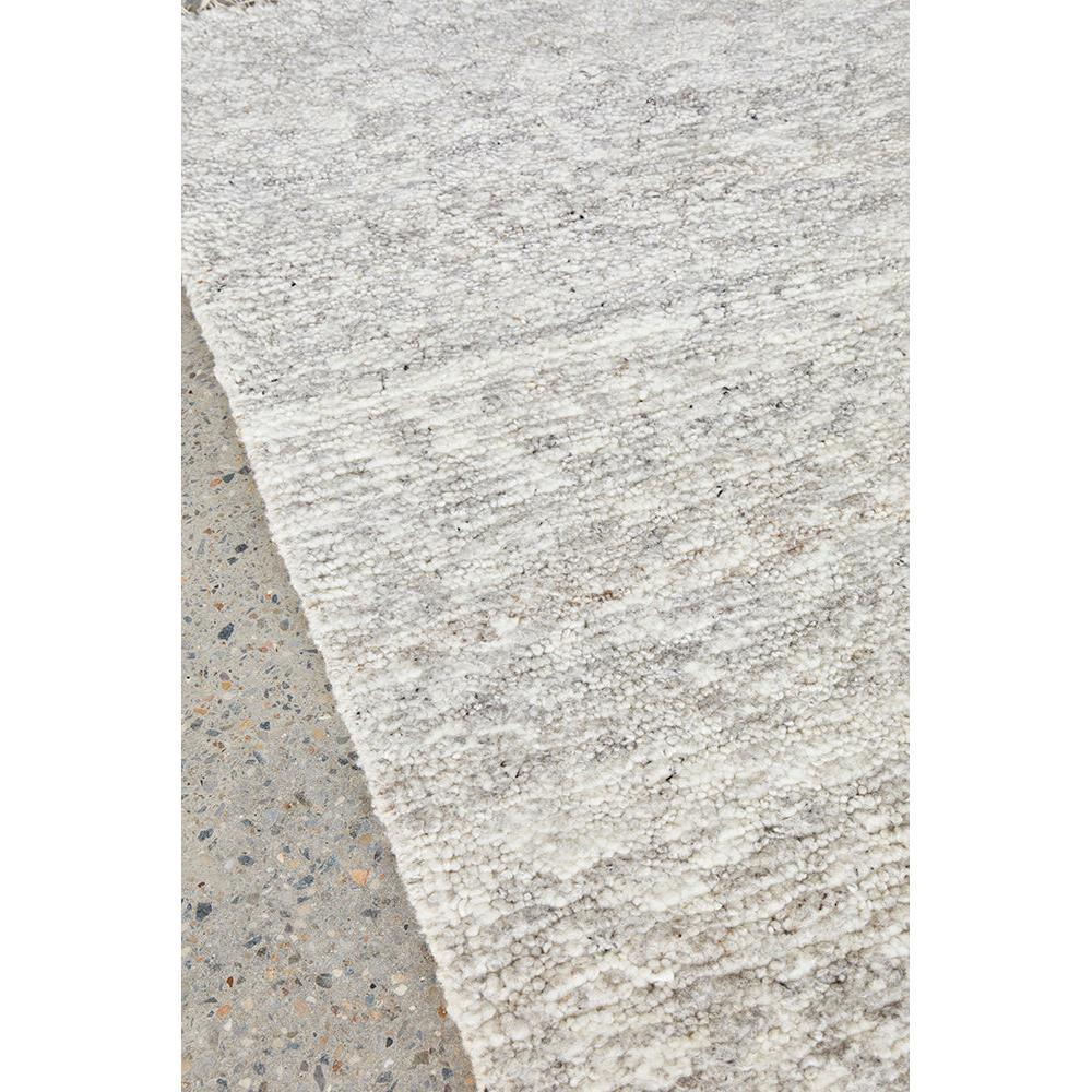 Darren Palmer Travertine Silver Rug featuring textured shag in ivory, grey and taupe on concrete grey, hand-tufted wool