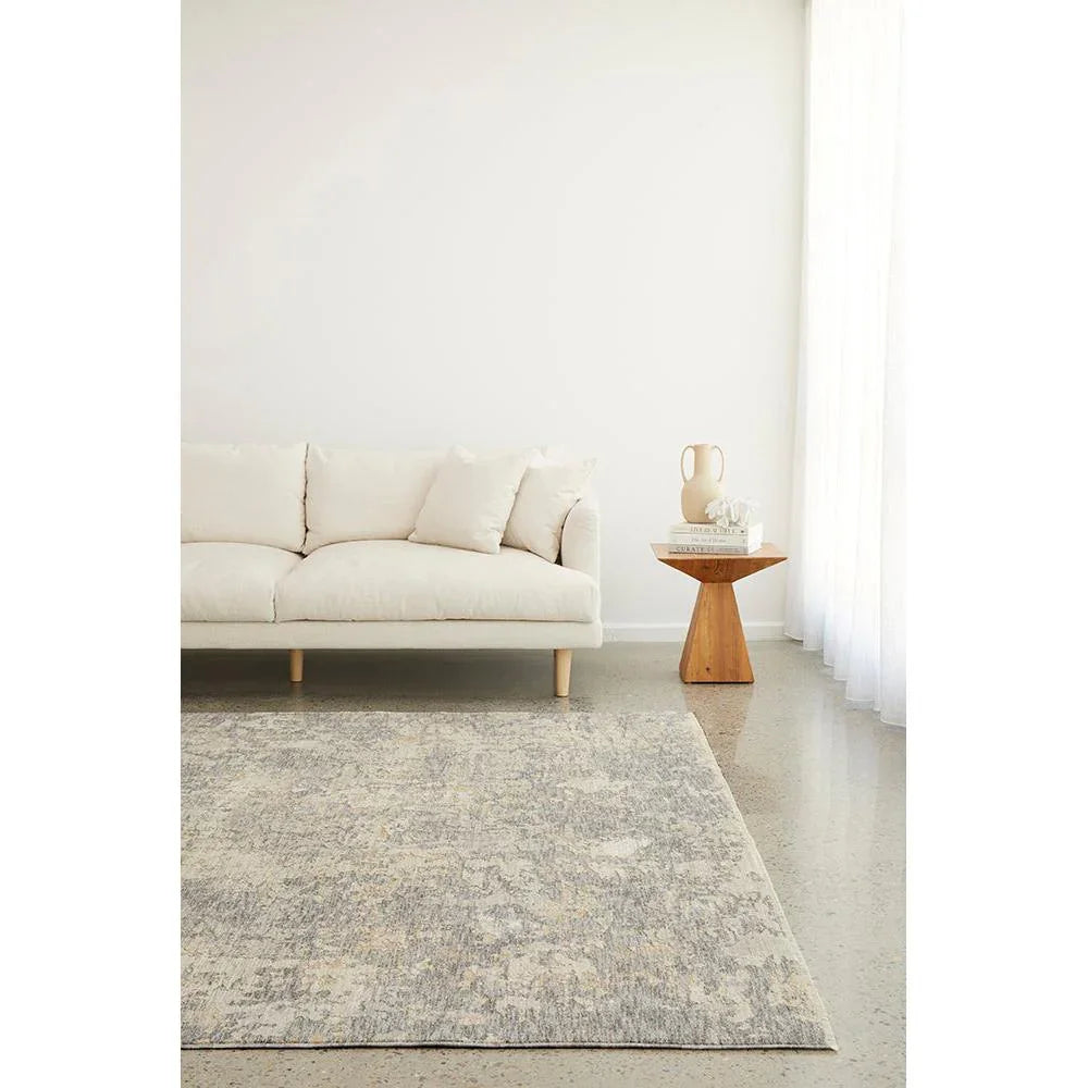 Emma Blomfield Haze Slate Rug featuring softly abstract pattern in slate blue, grey and ivory on cream background, power-loomed wool