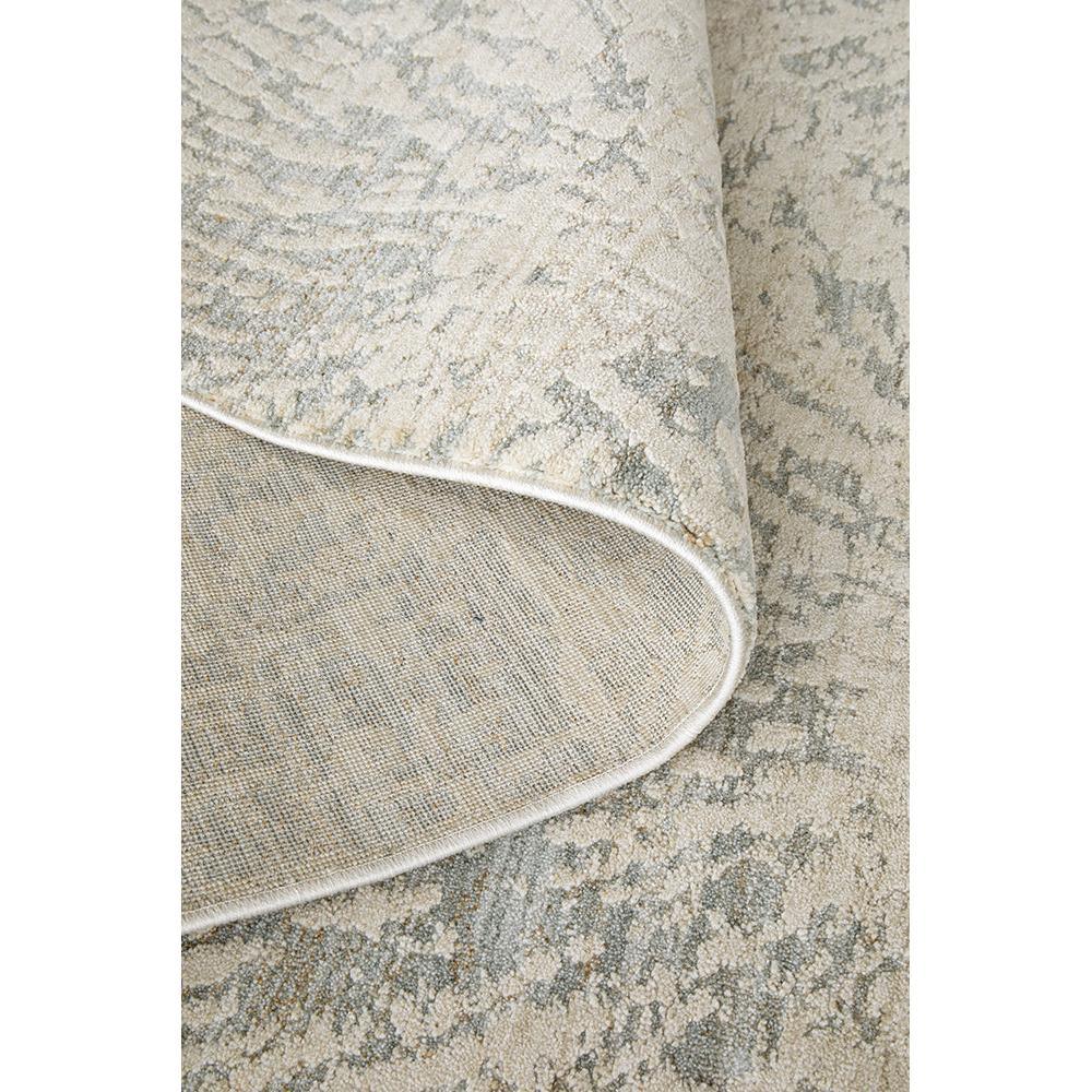 Emma Blomfield Plume Frost Rug featuring distressed pattern in ivory, dusty blue-grey and taupe on cream, hand-tufted wool