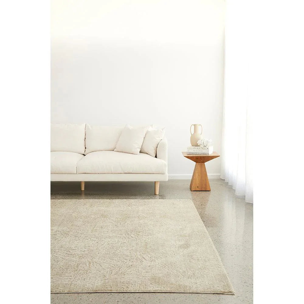 Emma Blomfield Plume Oat Rug featuring plume pattern in oat, cream and beige on light grey floor, hand-tufted wool