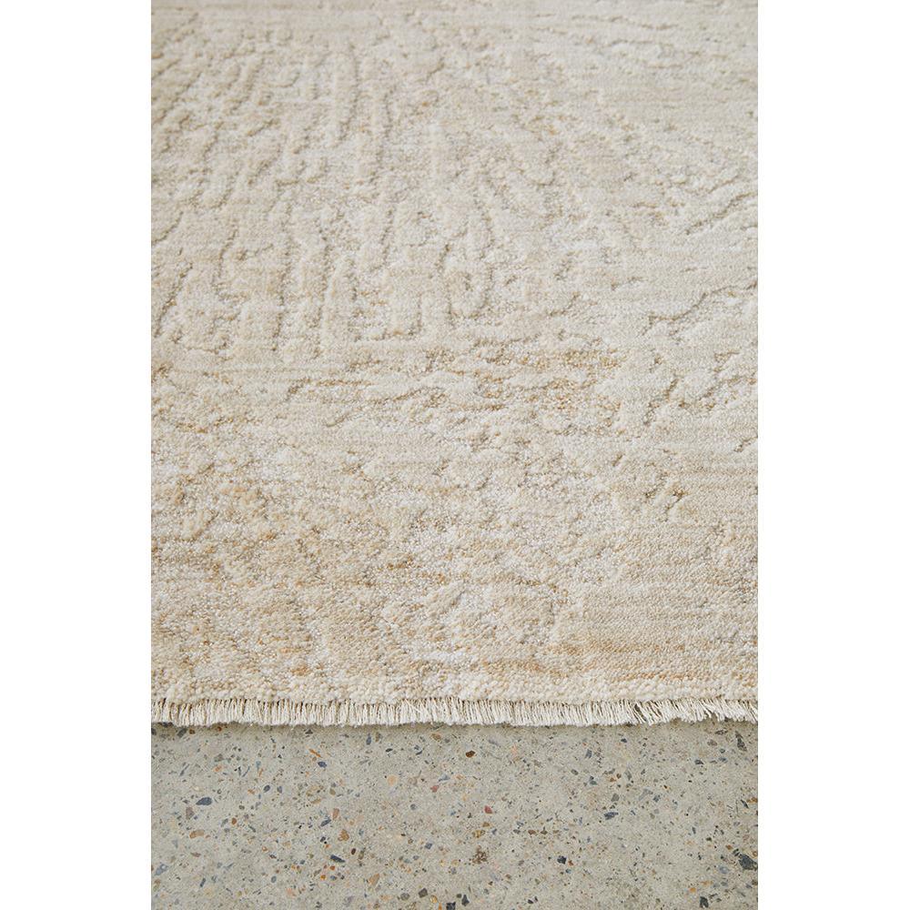 Emma Blomfield Plume Oat Rug featuring textured abstract pattern in oat, cream, sand on light grey concrete, tufted wool
