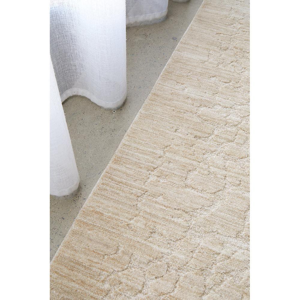 Emma Blomfield Rogue Linen Rug featuring subtle geometric pattern in beige, cream and ivory on sand, hand-loomed linen