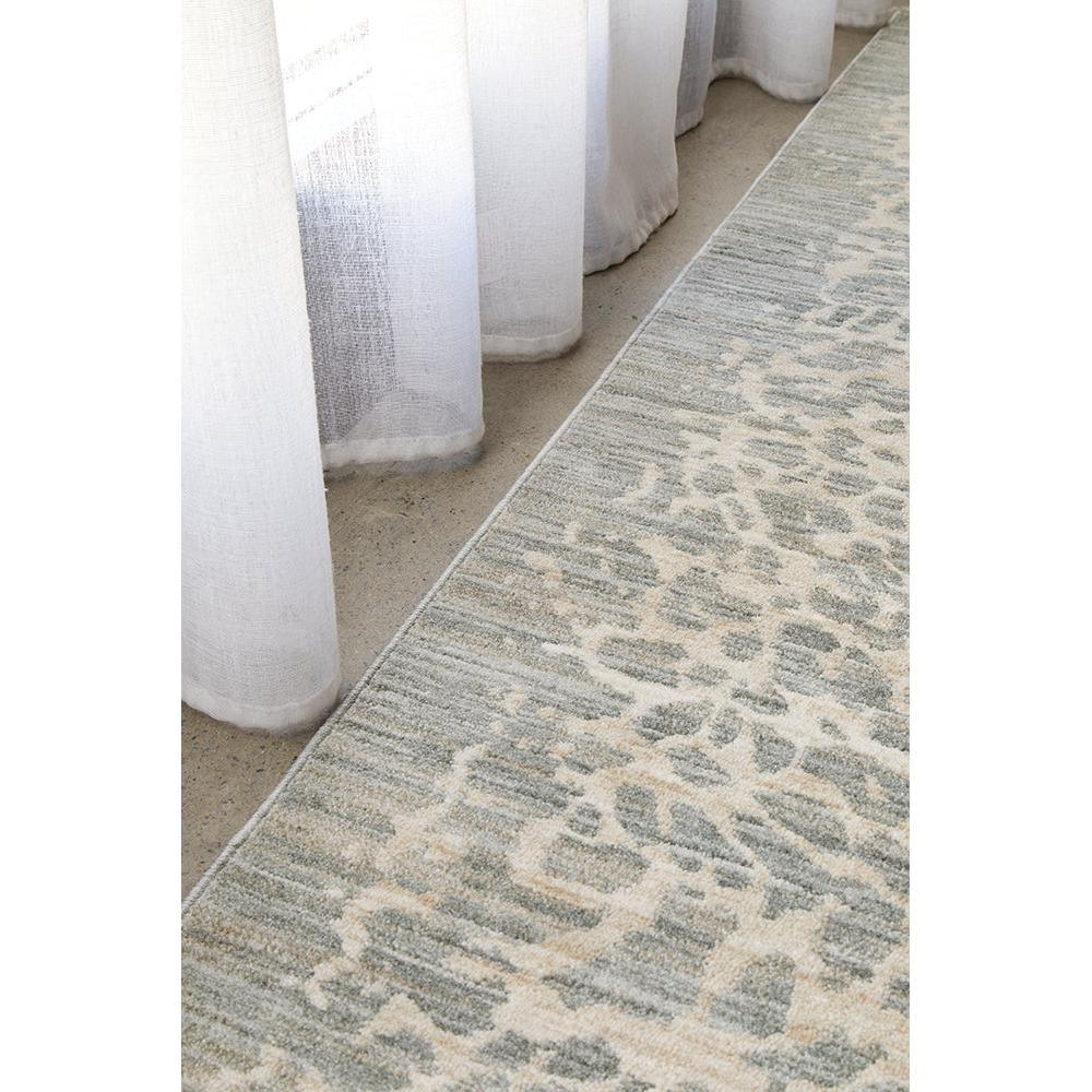 Emma Blomfield Rogue Mist Rug featuring animal‑print‑inspired pattern in slate grey, cream and beige on grey background, hand‑tufted wool