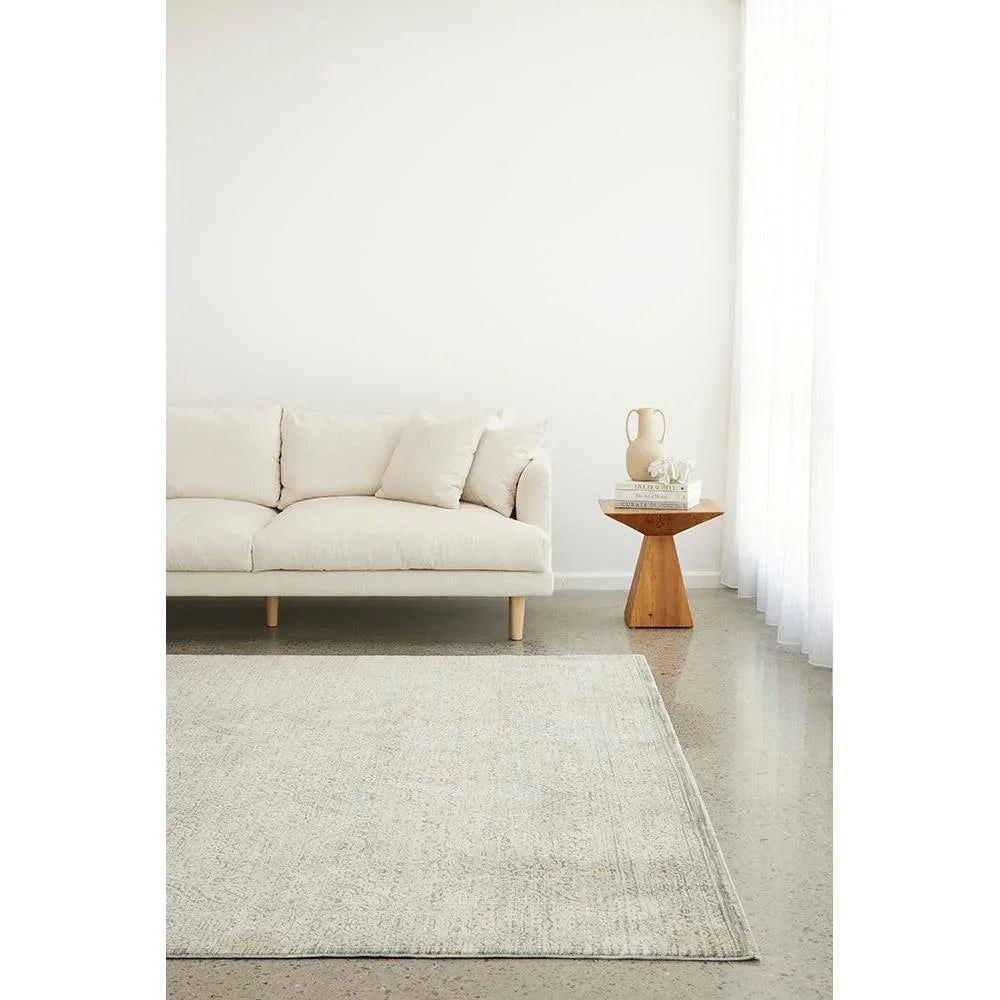 Emma Blomfield Veil Blue Rug featuring distressed pattern in ivory, cream and grey on ivory background hand-tufted wool