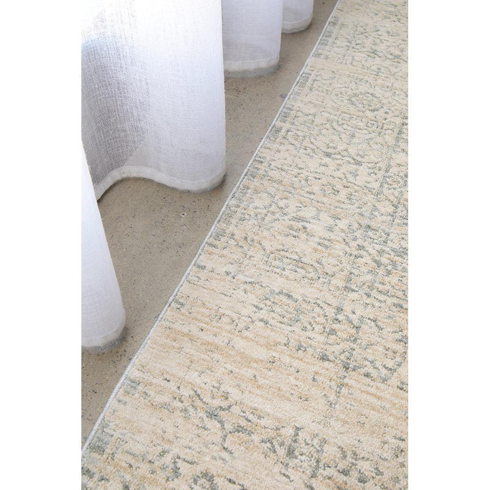 Emma Blomfield Veil Blue Rug featuring distressed vintage floral pattern in cream and blue-grey on pale beige background