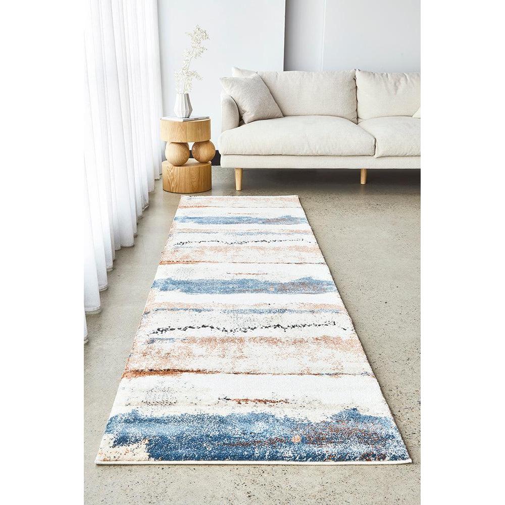 Long, narrow rug with horizontal stripes in a neutral color palette on a light-colored floor.