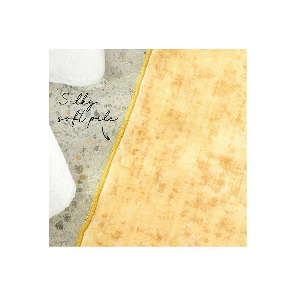 Gemstone Amber Rug featuring silky soft pile in amber, golden yellow and cream on pale background, hand-tufted wool