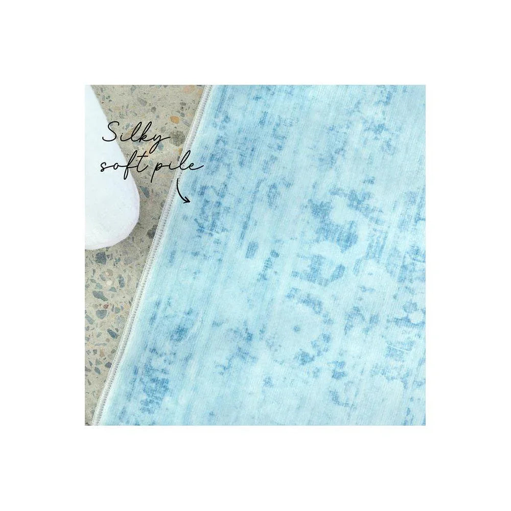 Gemstone Aquamarine Rug featuring soft blue-toned marble pattern in aquamarine, sky blue and ivory on a light background, hand-tufted wool