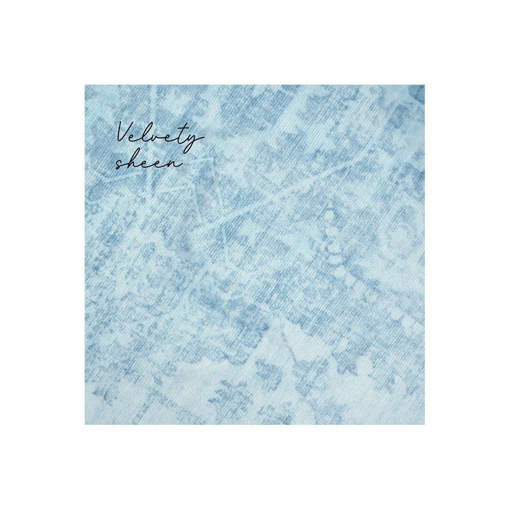 Gemstone Aquamarine Rug featuring marbled pattern in aquamarine, sky blue and white on pale blue background, hand-tufted wool