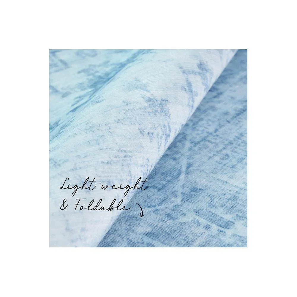 Gemstone Aquamarine Rug featuring marbled pattern in aquamarine, light blue and sky blue on white background, lightweight foldable rug