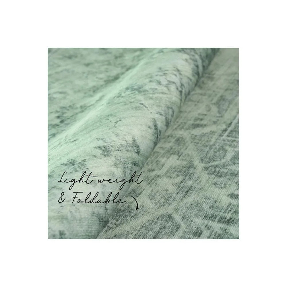 Gemstone Emerald Green Rug featuring distressed abstract pattern in emerald, sage and grey on light mint background, machine-woven polyester