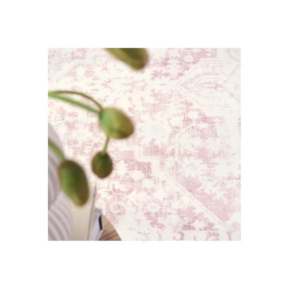 Gemstone Rose Quartz Rug featuring floral-inspired pattern in rose pink, dusty pink and cream on pale background, hand-tufted wool