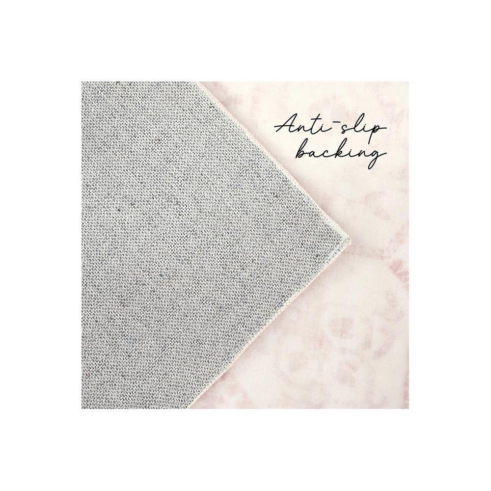 Gemstone Rose Quartz Rug featuring grey woven pattern on pale pink background with anti-slip backing, machine-made polyester