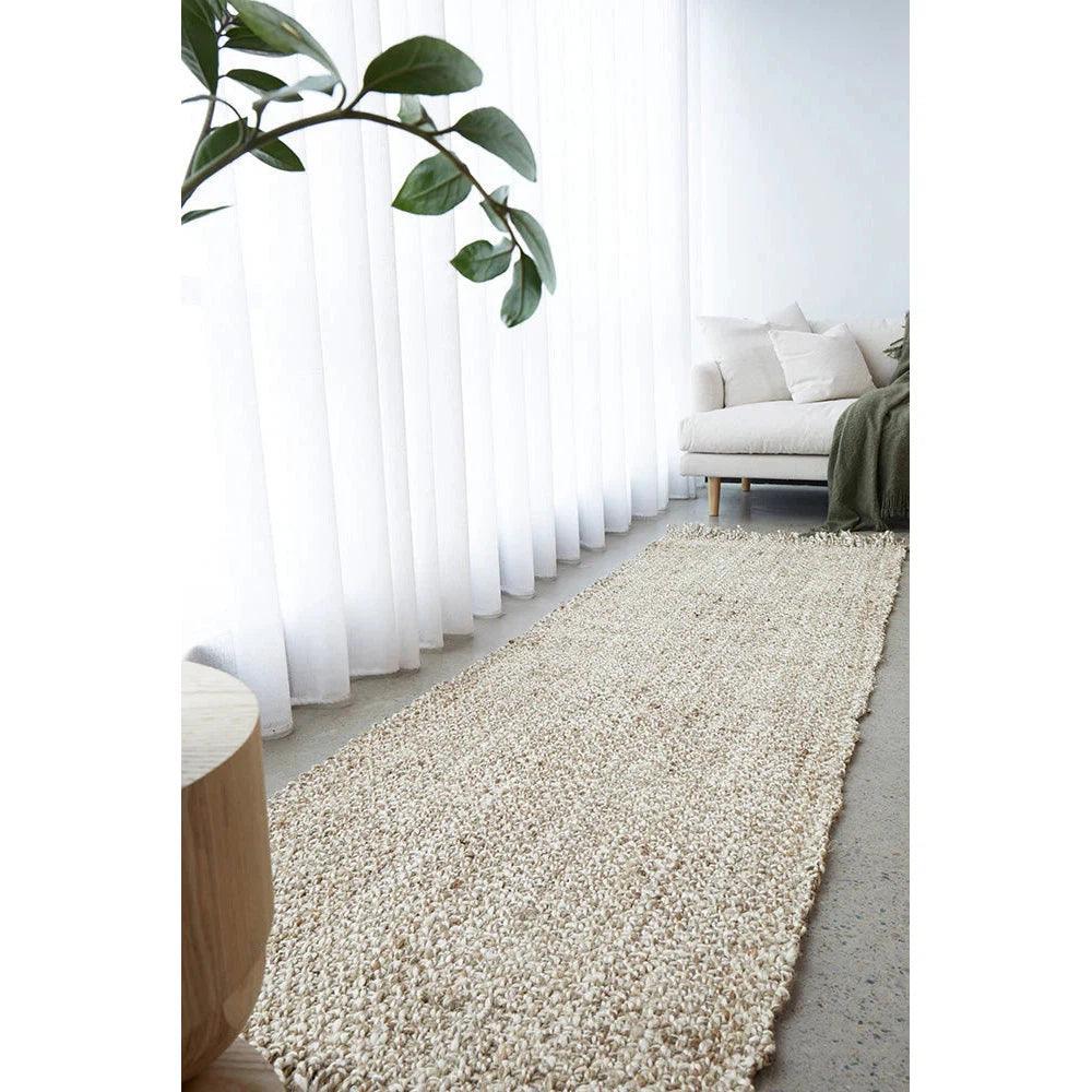 Harlow Parker Silver Rug featuring textured shaggy pattern in cream, ivory and taupe on light grey floor, hand-tufted wool