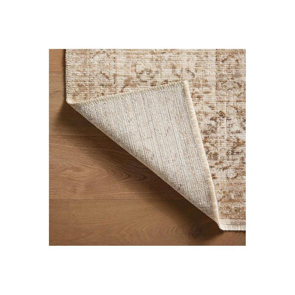 Heritage Ivory Rug featuring distressed vintage pattern in ivory, taupe and beige on warm ivory background, machine-woven synthetic fibers