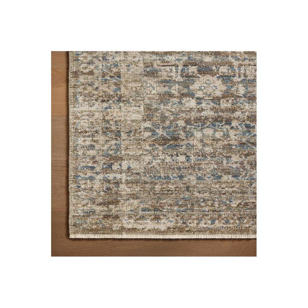 Heritage Spa Rug featuring distressed pattern in beige, taupe, blue and brown on cream background by Rug Culture