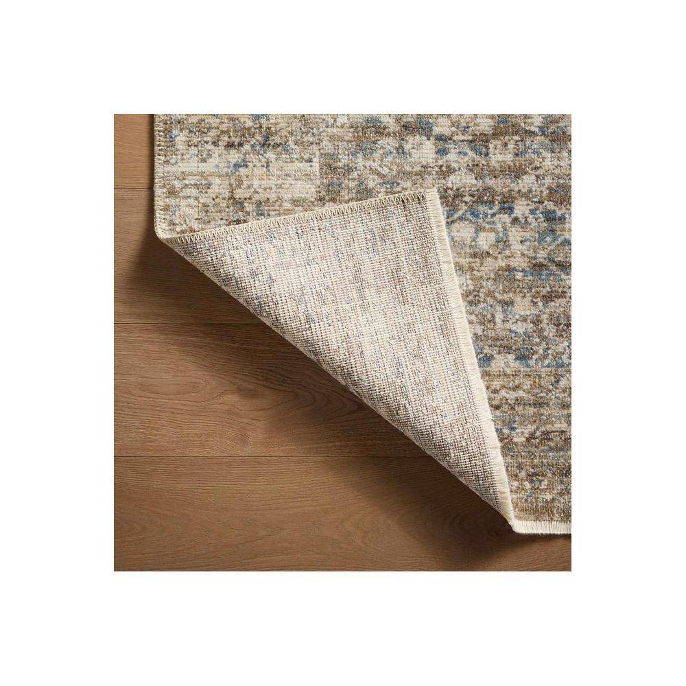 Heritage Spa Rug by Rug Culture featuring distressed vintage pattern in beige, cream, blue and grey on warm wood floor
