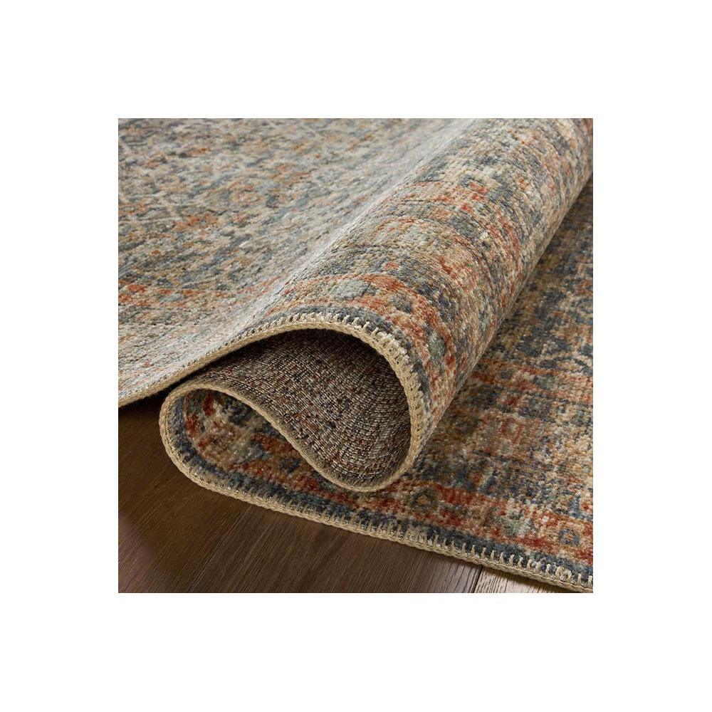 Heritage Blue Rug featuring distressed oriental pattern in navy, sky blue, beige and rust on ivory background, hand-tufted wool