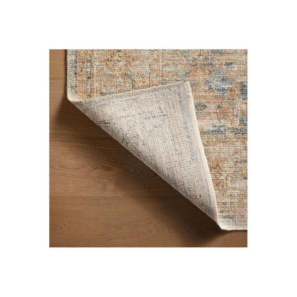 Heritage Ocean Rug featuring distressed vintage floral pattern in navy blue, sky blue, beige on ivory background, hand-tufted wool