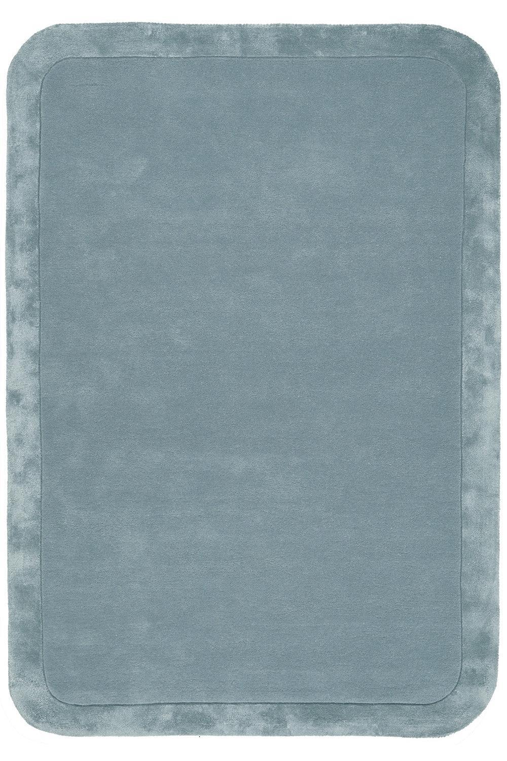 Rectangular bath mat with a textured surface in a cool gray color