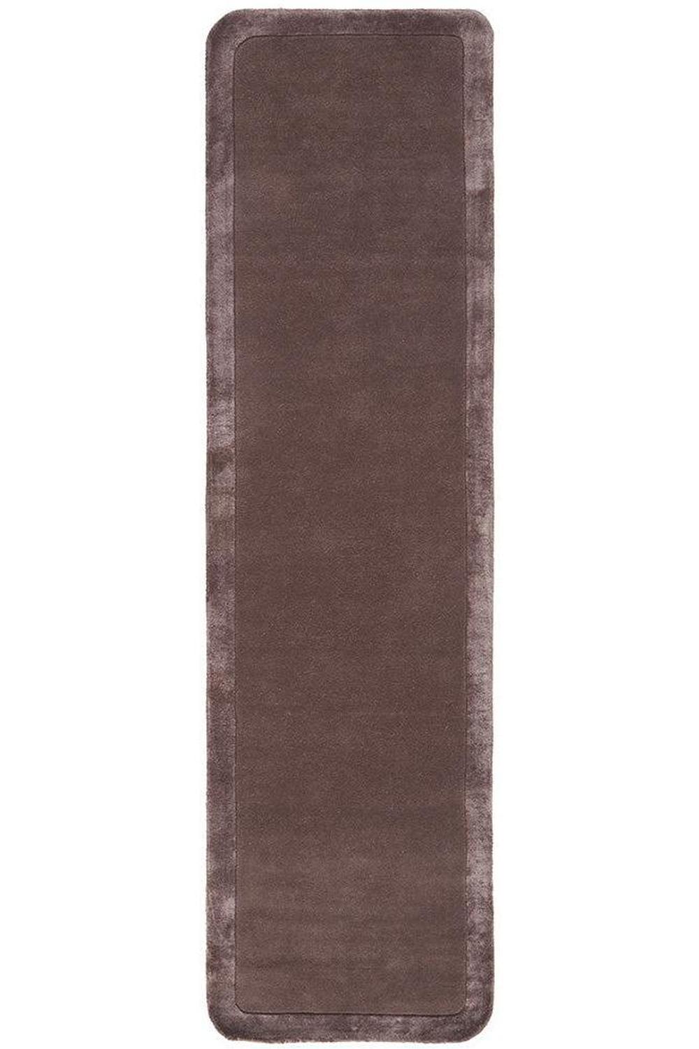 Brown rectangular rug on a white background