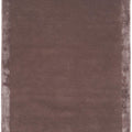 Rectangular brown bath mat with a textured surface