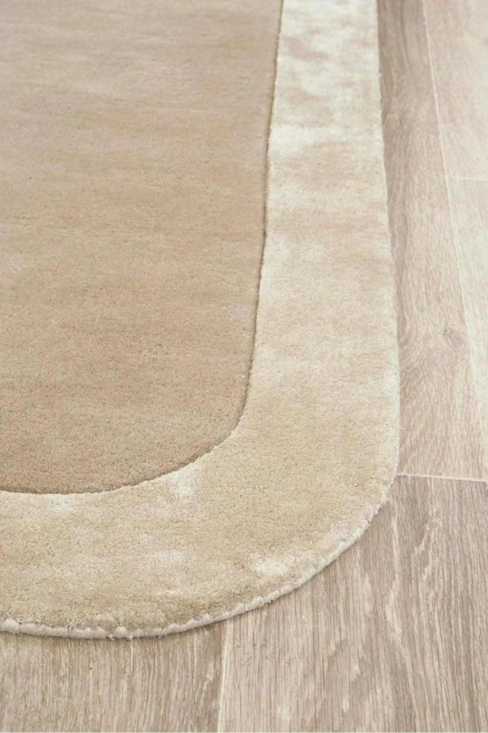 Hugo Husk Runner Rug featuring minimal plain design in beige, tan and ivory on pale oak background, hand-tufted wool