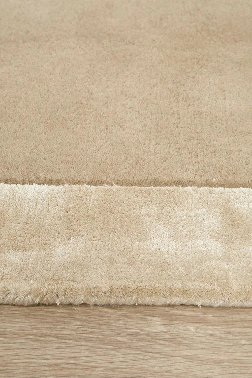 Hugo Husk Runner Rug featuring shag texture in oatmeal beige and cream on warm beige background, hand-tufted wool