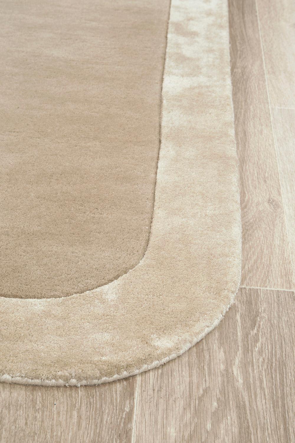 Beige rug on a wooden floor